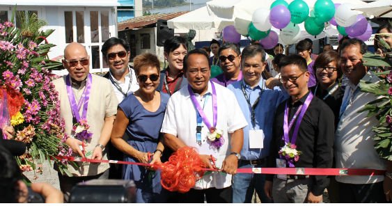 Ad Summit officials cut the ribbon at the trade exhibit