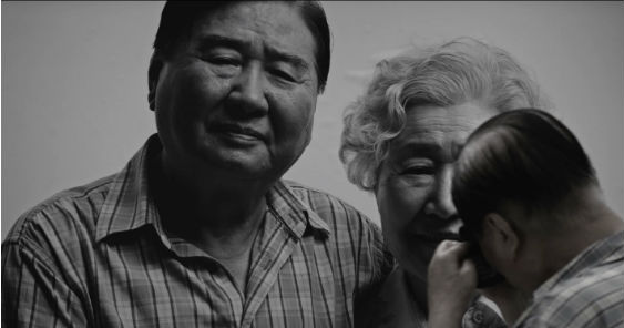 2 The Last Wish_an old man shedding tears in front of his family photo at the exhibition 563.jpg