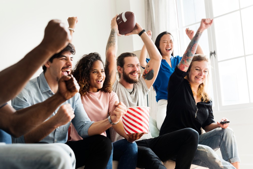 friends at home watching super bowl match